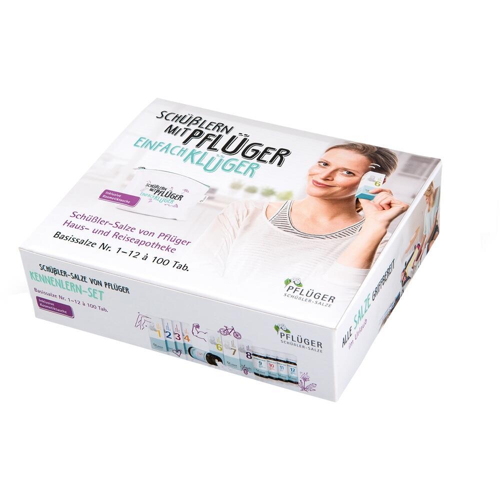 Eine weiße Box mit Schüßler-Salzen und einer lächelnden Frau.